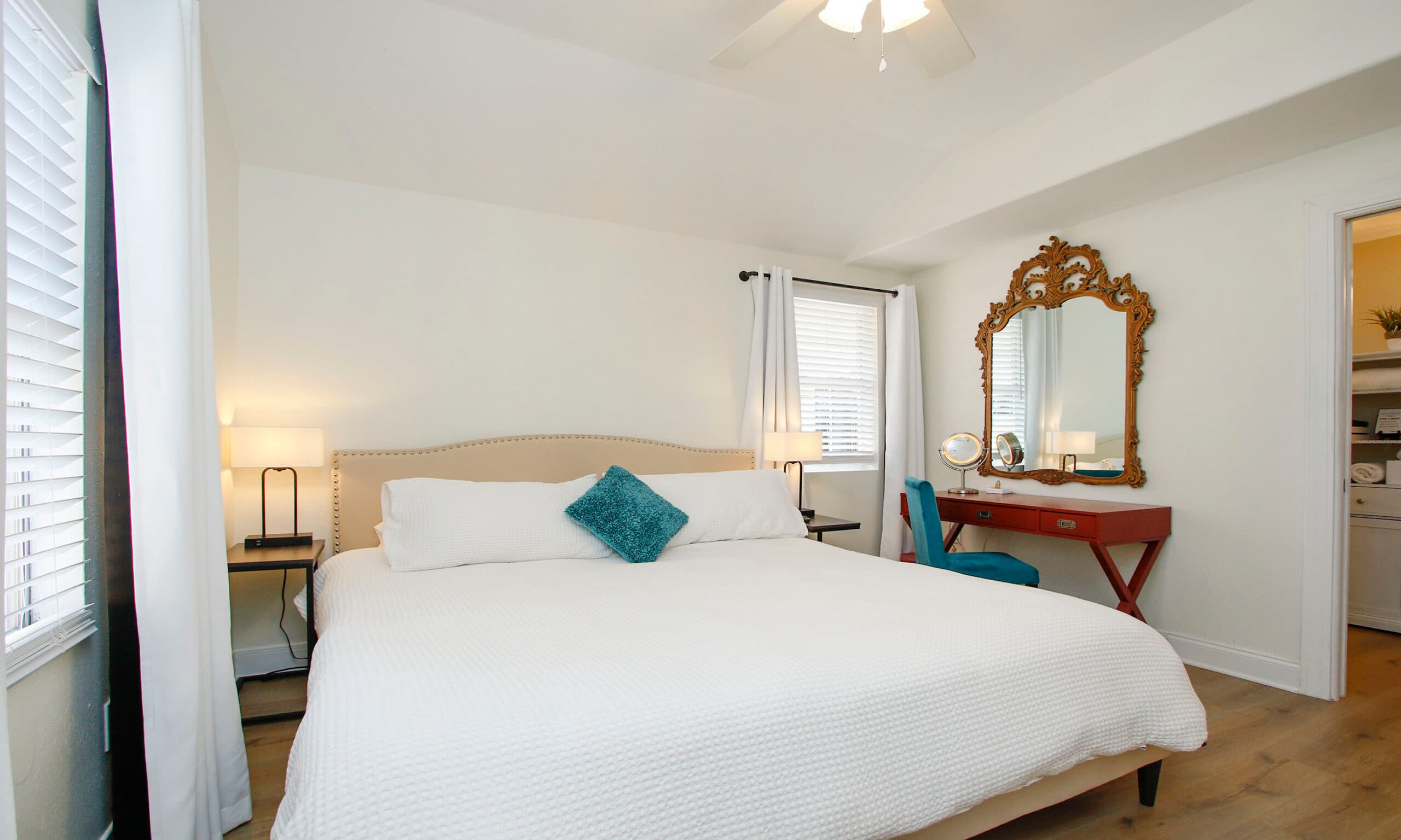 Master bedroom with king bed and ensuite bathroom visible